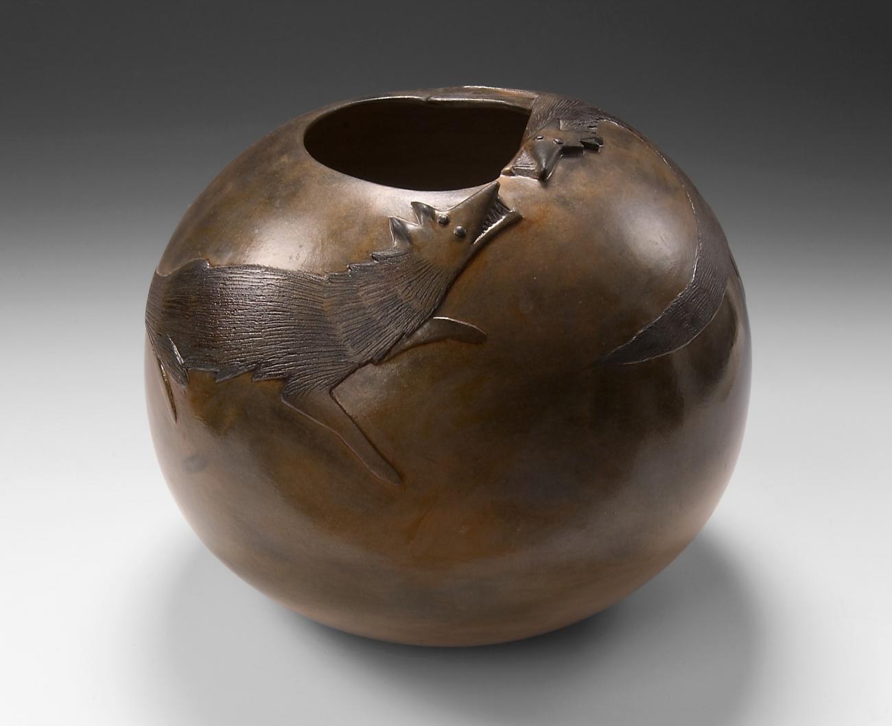 Pot with wolves engaging with each other