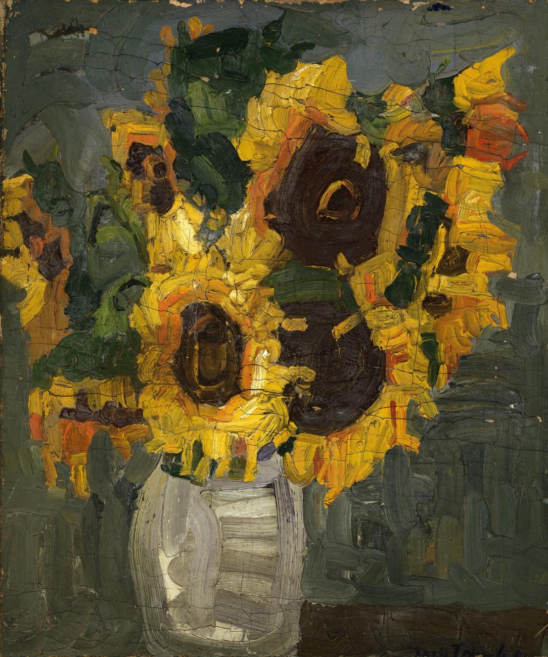 A still life of sunflowers in a translucent white vase