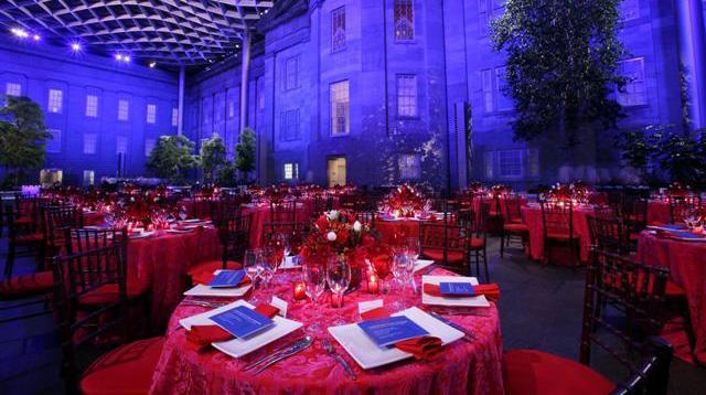 A photograph of the Kogod Courtyard at night with a special event