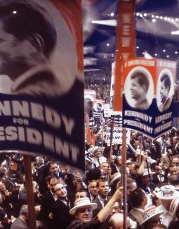 Crowd of people holding Kennedy for President signs