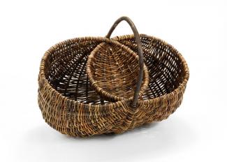 A basket that looks like two separate circular shapes merged together with a handle.