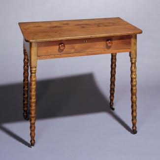 A walnut, maple, and yellow pine Cottage style dressing table.