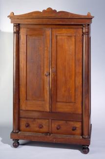 A poplar and yellow pine Classical style wardrobe. 
