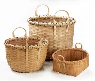 Three baskets of different heights that all have two round circle handles.