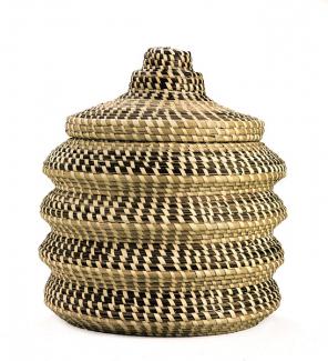 A basket with four undulating sides and a lid.
