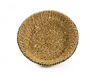 A basket that resembles a large bowl made from thin honeysuckles vine.