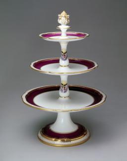 An image of a porcelain dessert stand with three tiers. 