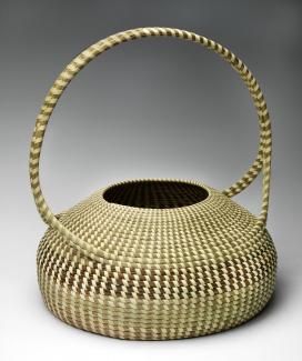A woven basket with a handle. 