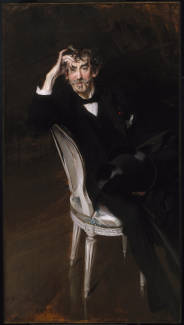 A portrait of James McNeill Whistler dressed in a black suit and seated in a chair.