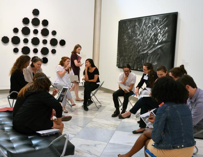 Teachers discuss artwork in gallery at the Smithsonian American Art Museum.