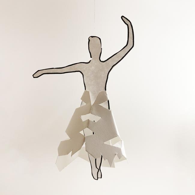 A paper ballerina dancing