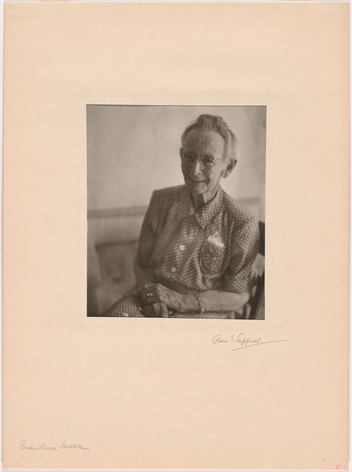 Grandma Moses Grandma Moses sits posing in a chair