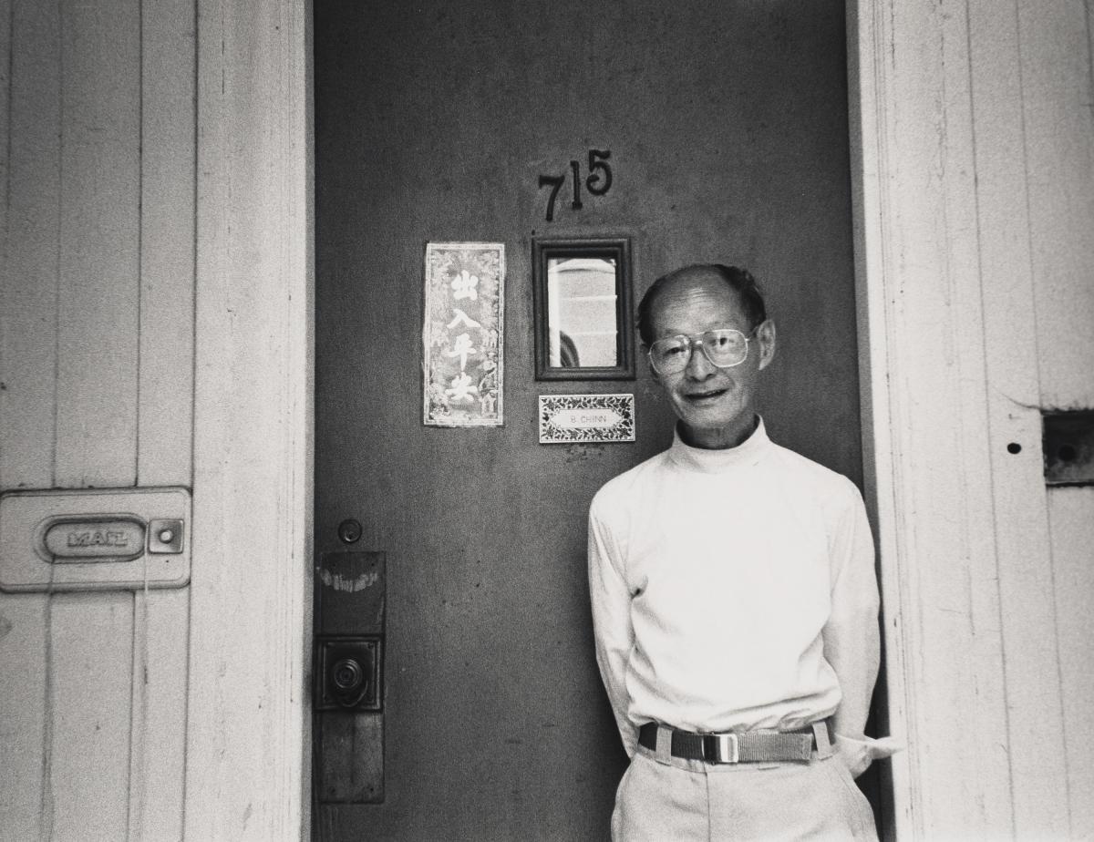 saam-2024.52.41.4_1.jpg Photo of person in front of door with the number 715 on it.