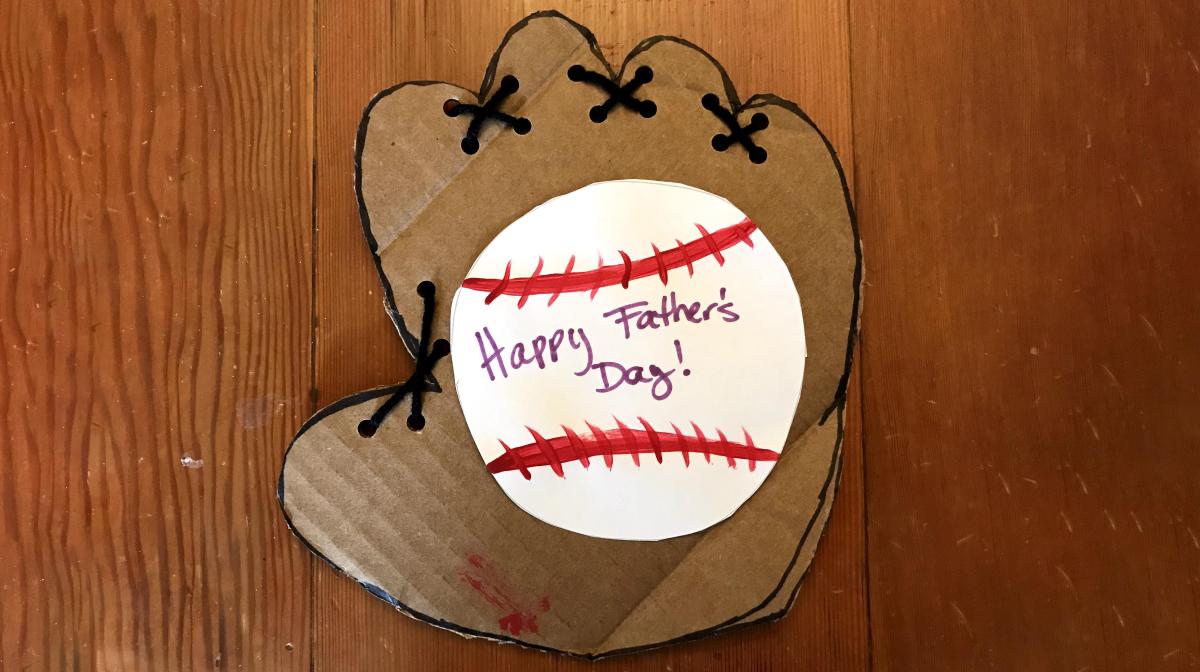 A photograph of a handmade card with a baseball
