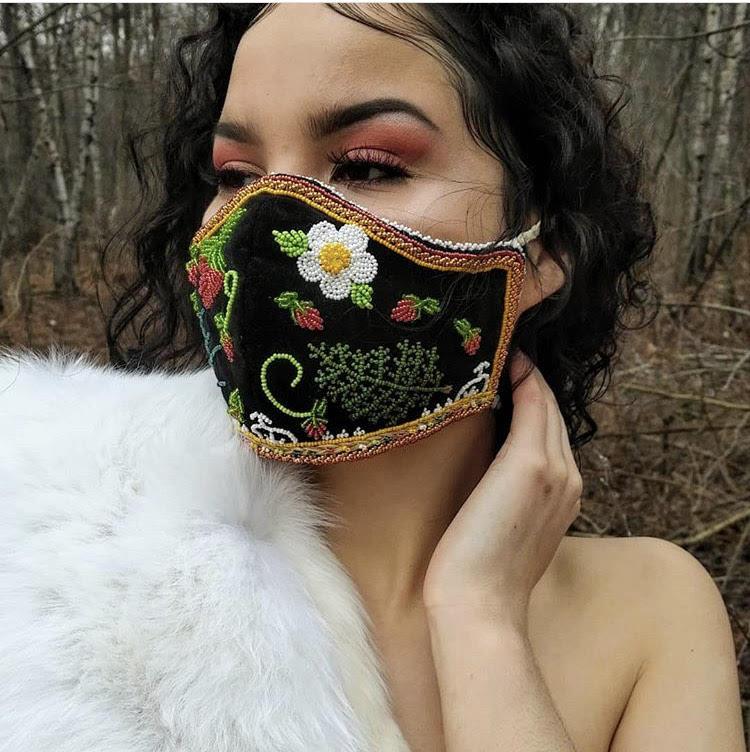 A photograph of a woman wearing a mask