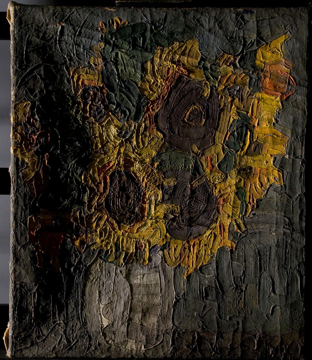 A damaged painting of sunflowers before conservation