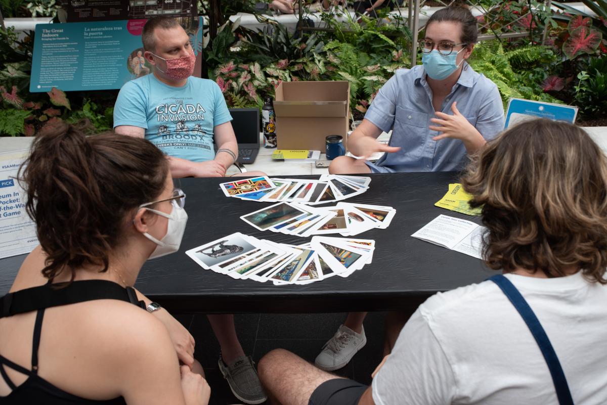 A group of four adults playing "Museum in My Pocket"