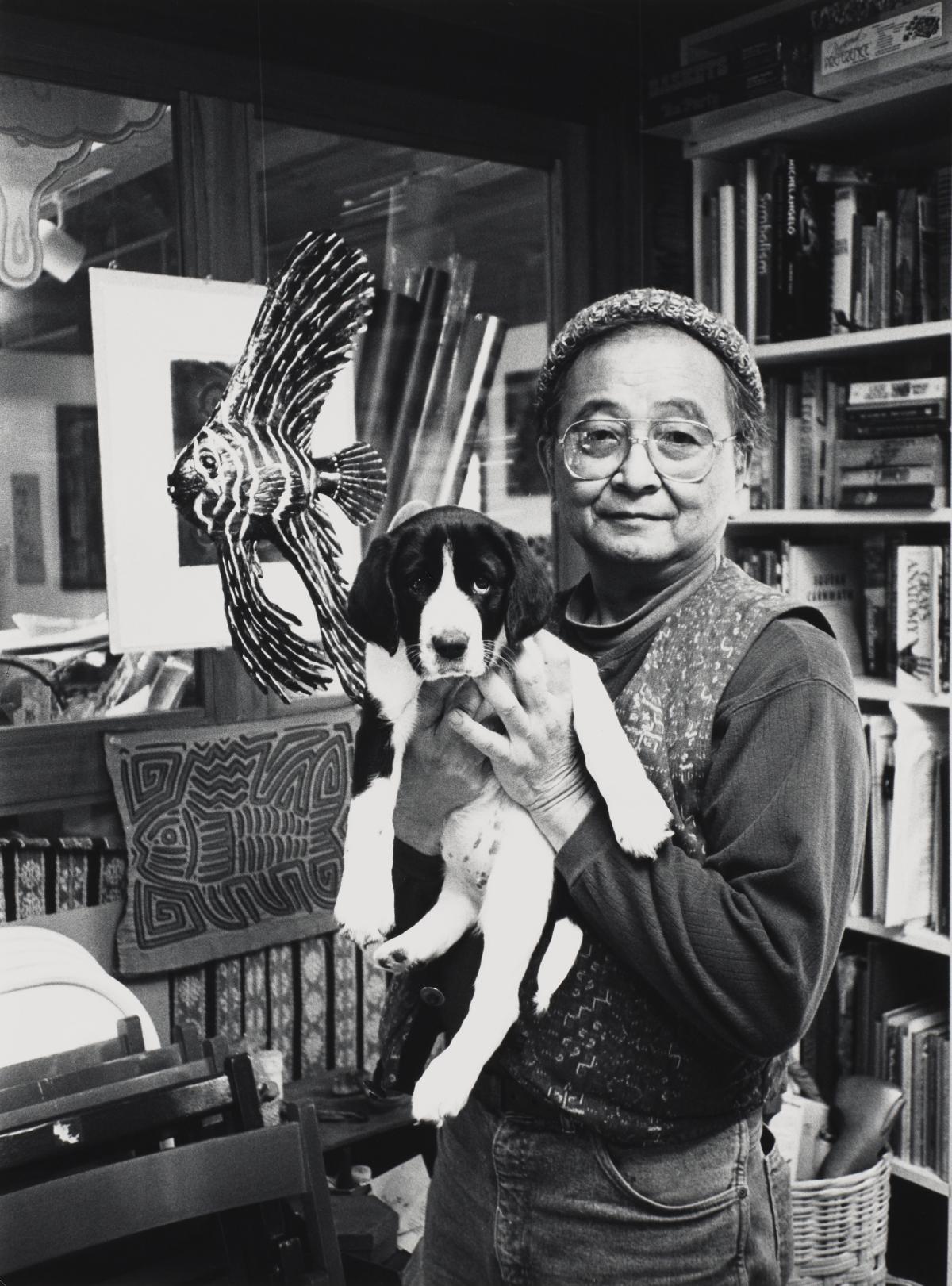 saam-2024.52.41.13_1.jpg photo of person holding a puppy