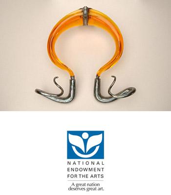 This is a sterling silver and polyester resin neckpiece 