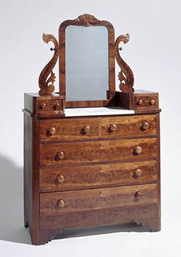A bureau made of mahogany, yellow pine, and poplar
