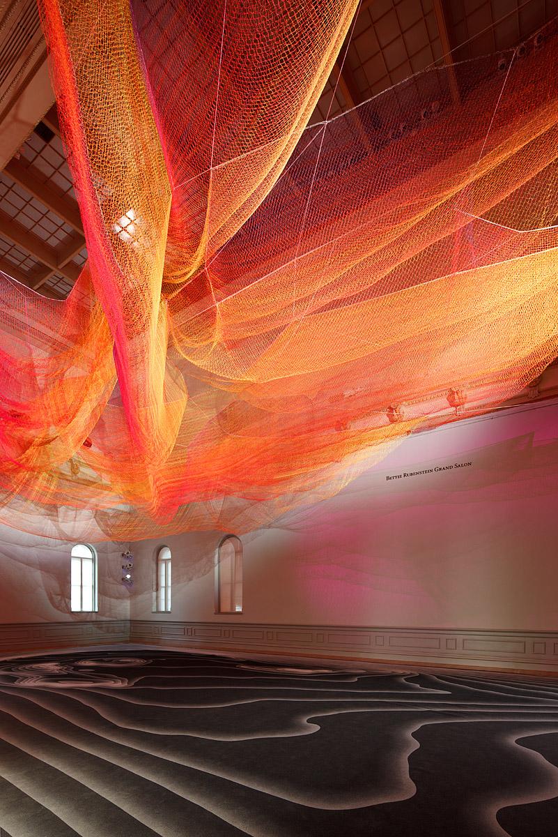 A photograph of a woven sculpture installed in the grand salon for WONDER at the Renwick Gallery. 