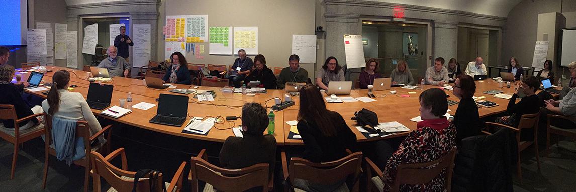 Members of the AAC gathered around large conference table