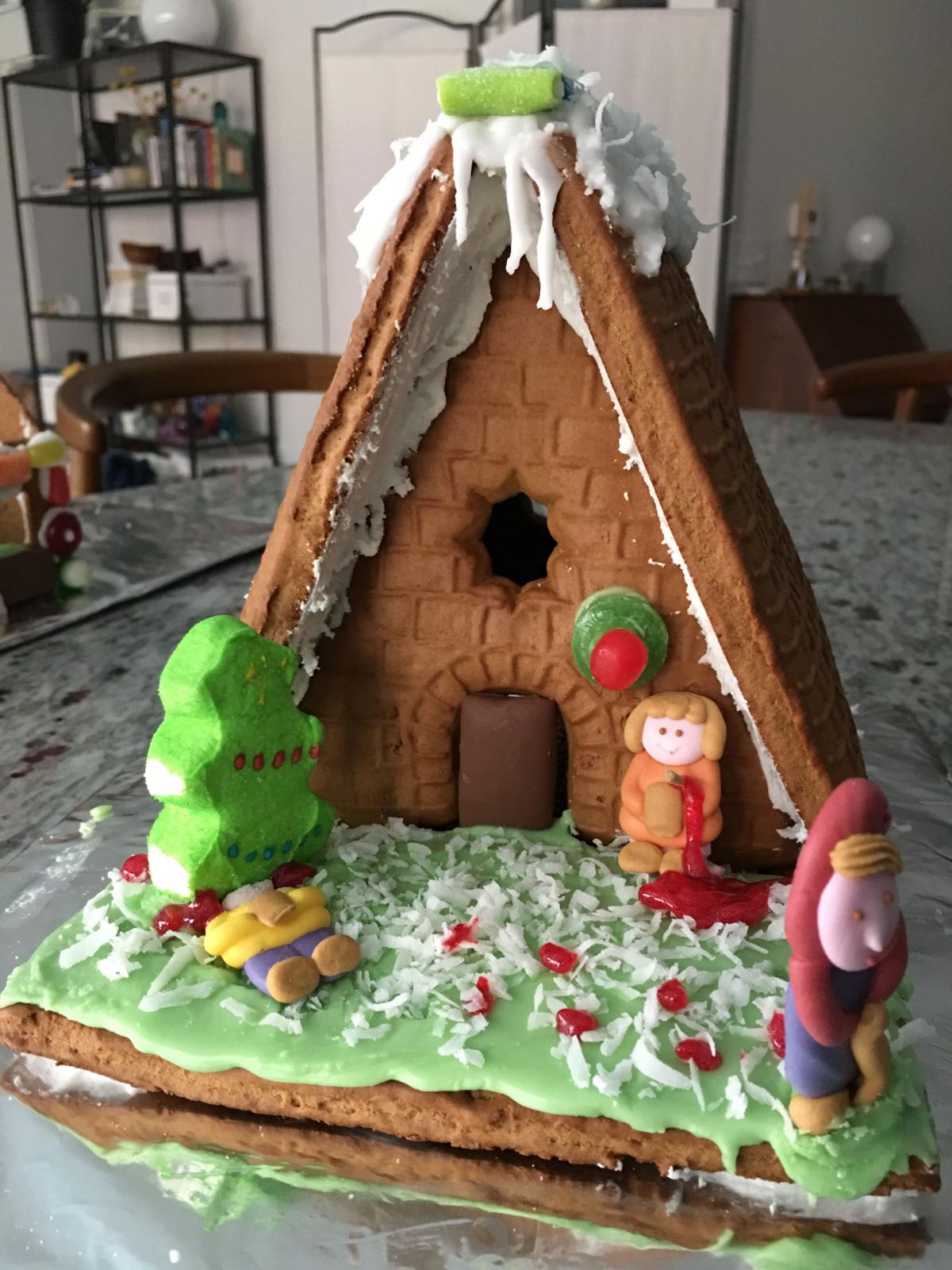 Gingerbread house decorated with candy.