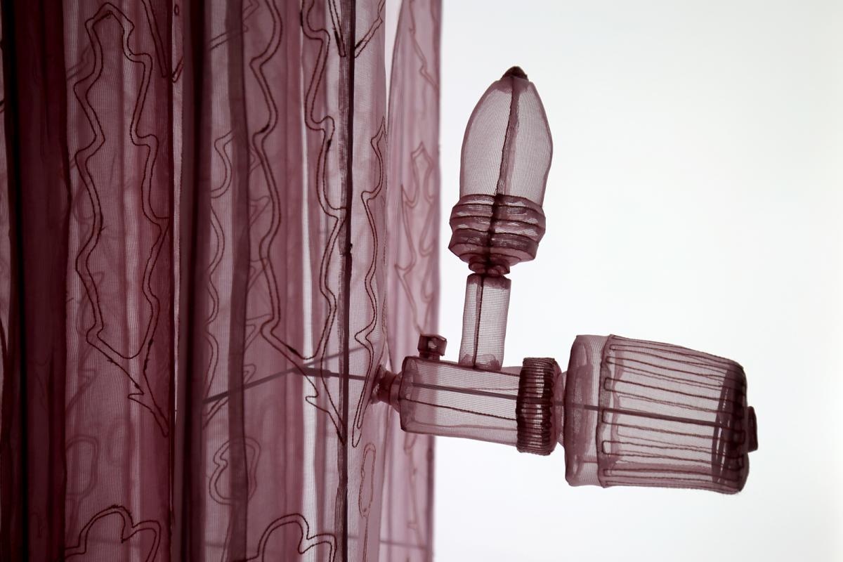 This is a photograph of Do Ho Suh's radiator made of mesh.
