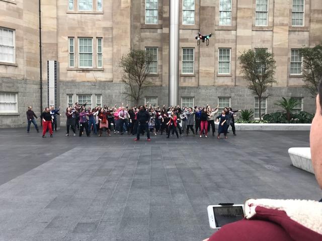An image of staff members dancing in the Courtyard at SAAM.