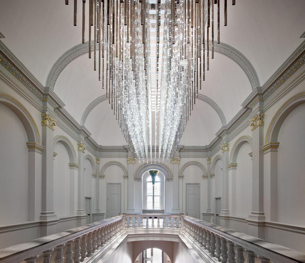 an image of the staircase with a grand LED chandelier at the Renwick Gallery.