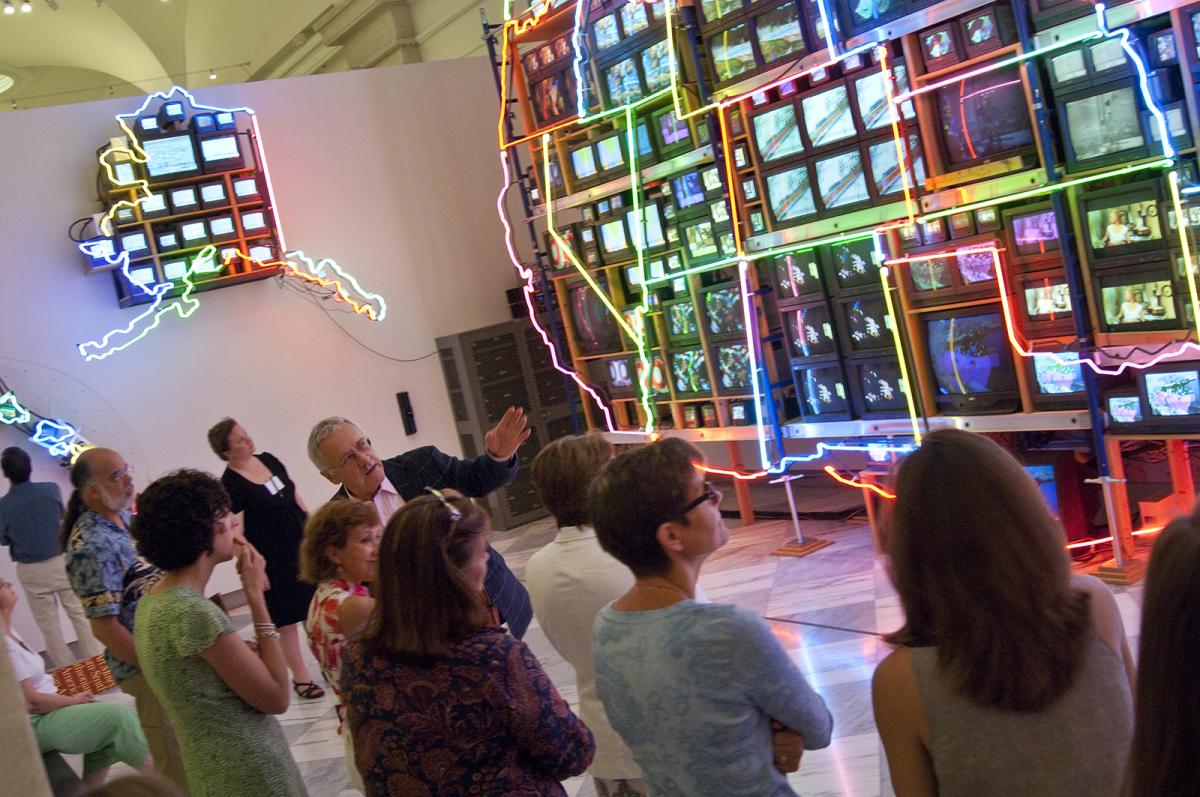 This is a docent tour in front of Nam June Paik's Superhighway at the Smithsonian American Art Museum.