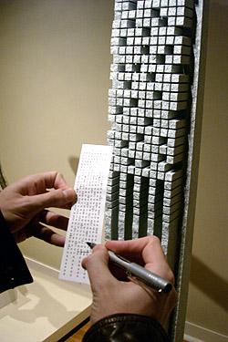 Searching for final clues in front of  Georgia Stele by Jesús Moroles