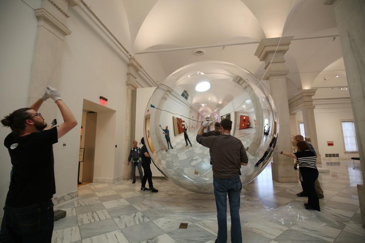 Installing the artist's Prototype for a Satellite in the exhibition Trevor Paglen: Sites Unseen