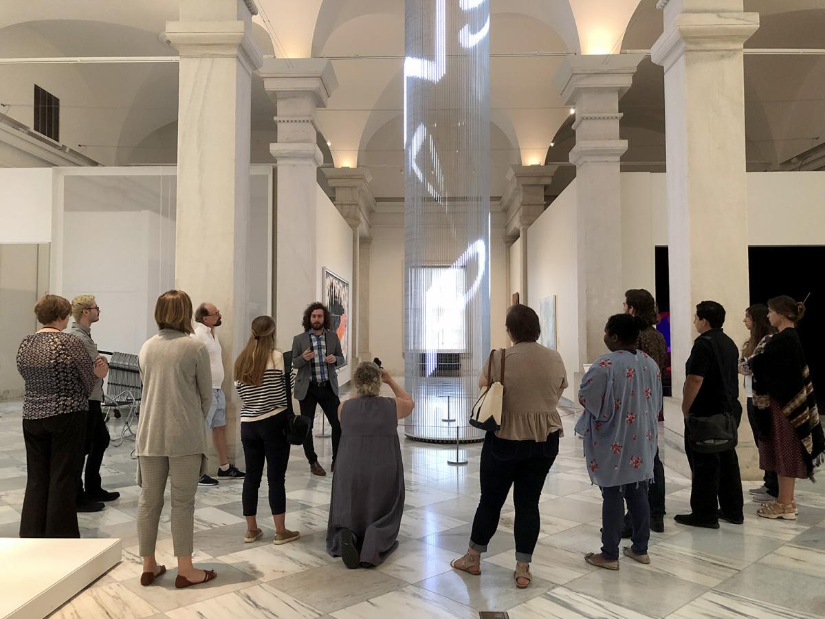 A picture with the Smithsonian American Art Museum's Conservator of Media Arts talking to a group.