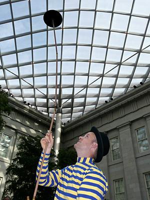 Man spinning plate at Kogod Opening