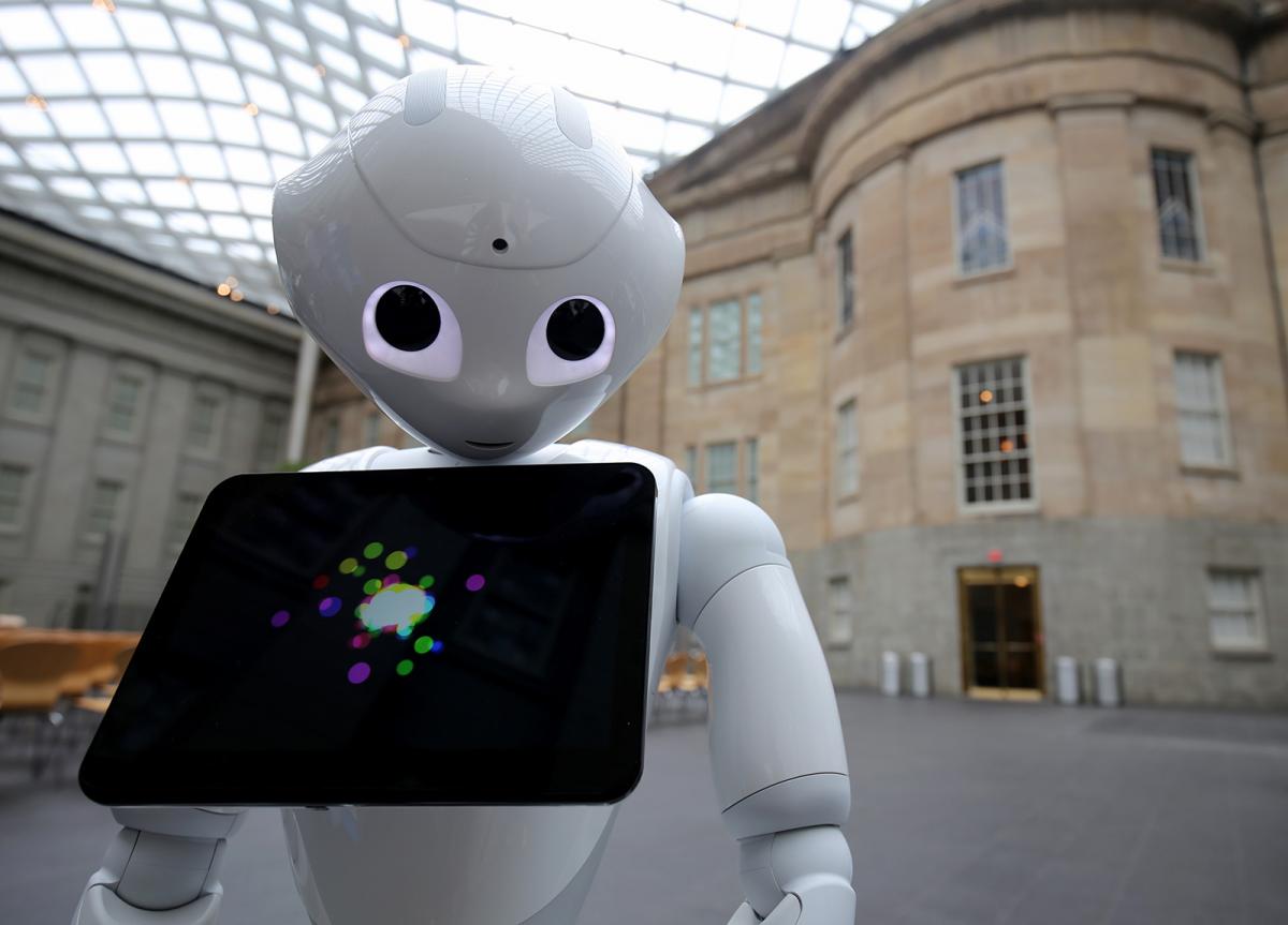A photograph of Pepper the Smithsonian Robot inside the Kogod Courtyard at the Smithsonian American Art Museum.