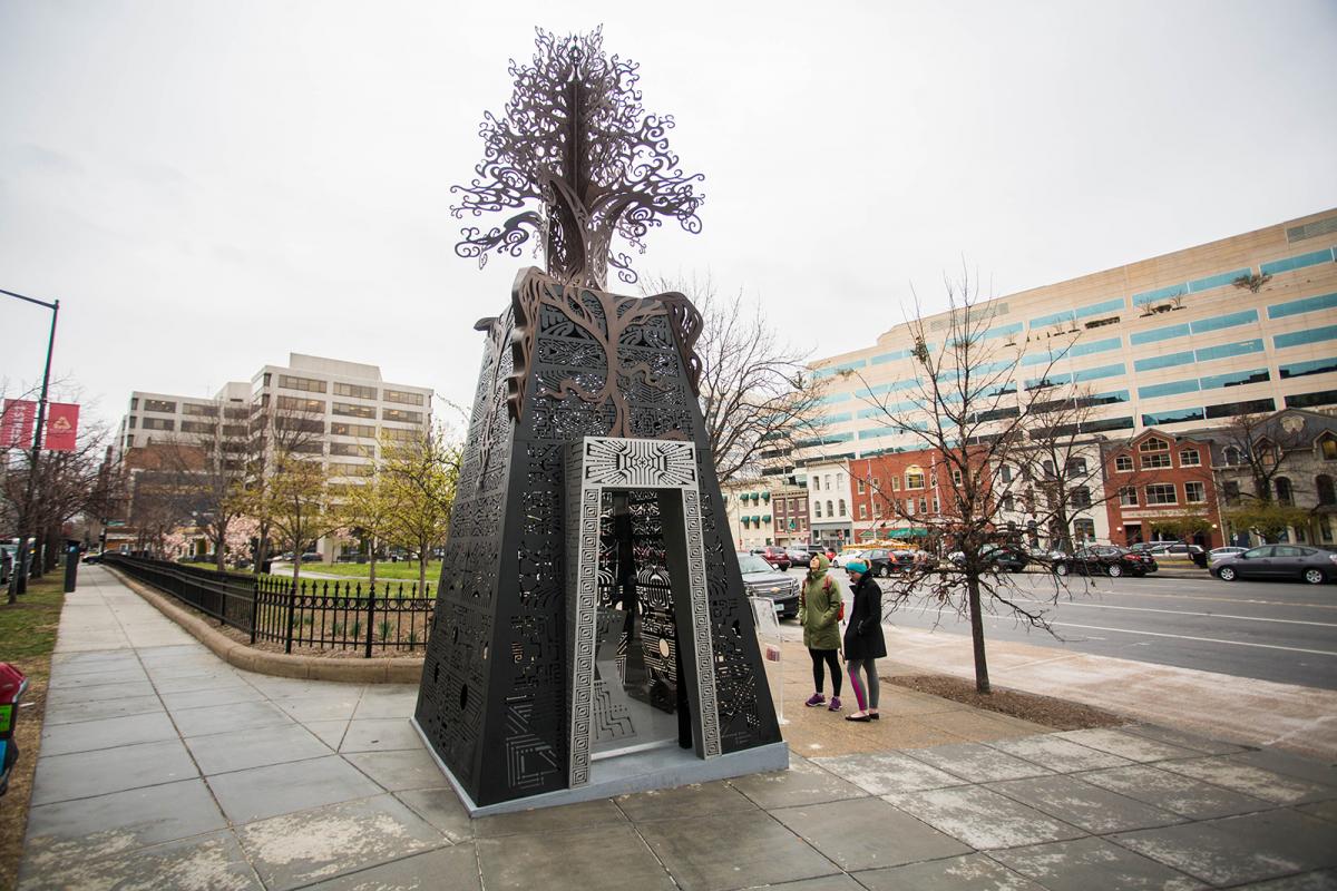 An image of a large scale structure with a tree on top.