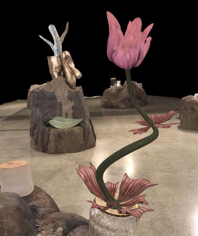 This is an image of a flower coming out of a tree trunk