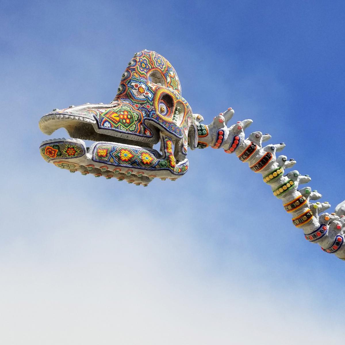 A photograph of a dinosaur artwork. 