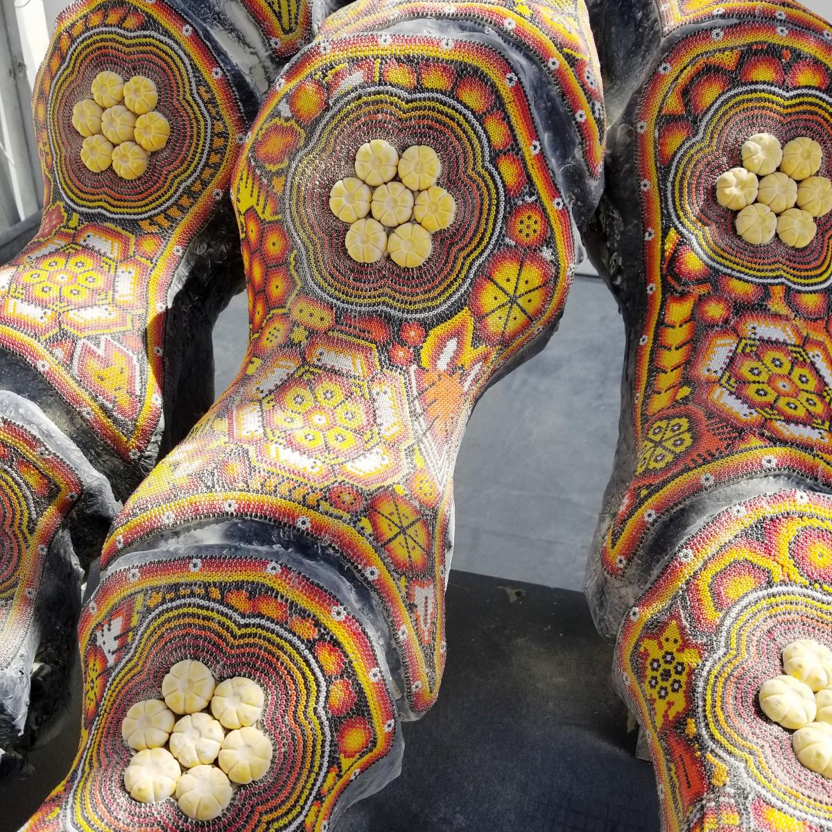A photograph of the detail in an artwork of a dinosaur. 