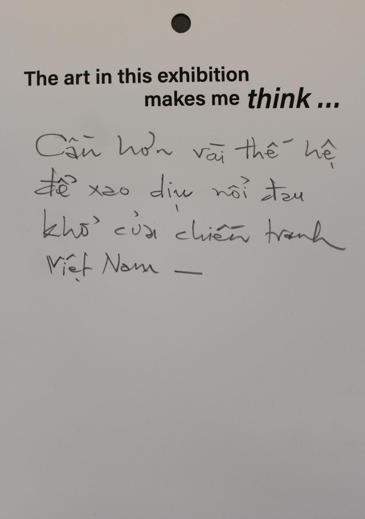 A visitor respond to the exhibition by writing in Vietnamese about the pain of the war