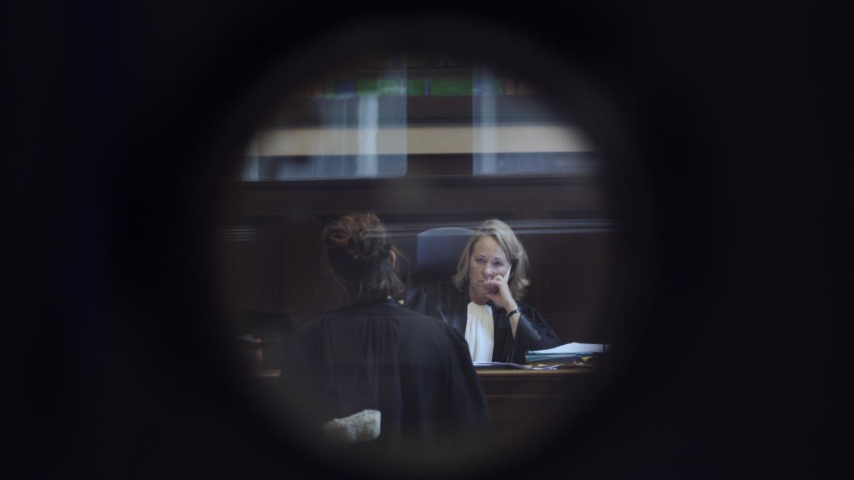 A photograph of two women sitting and talking.