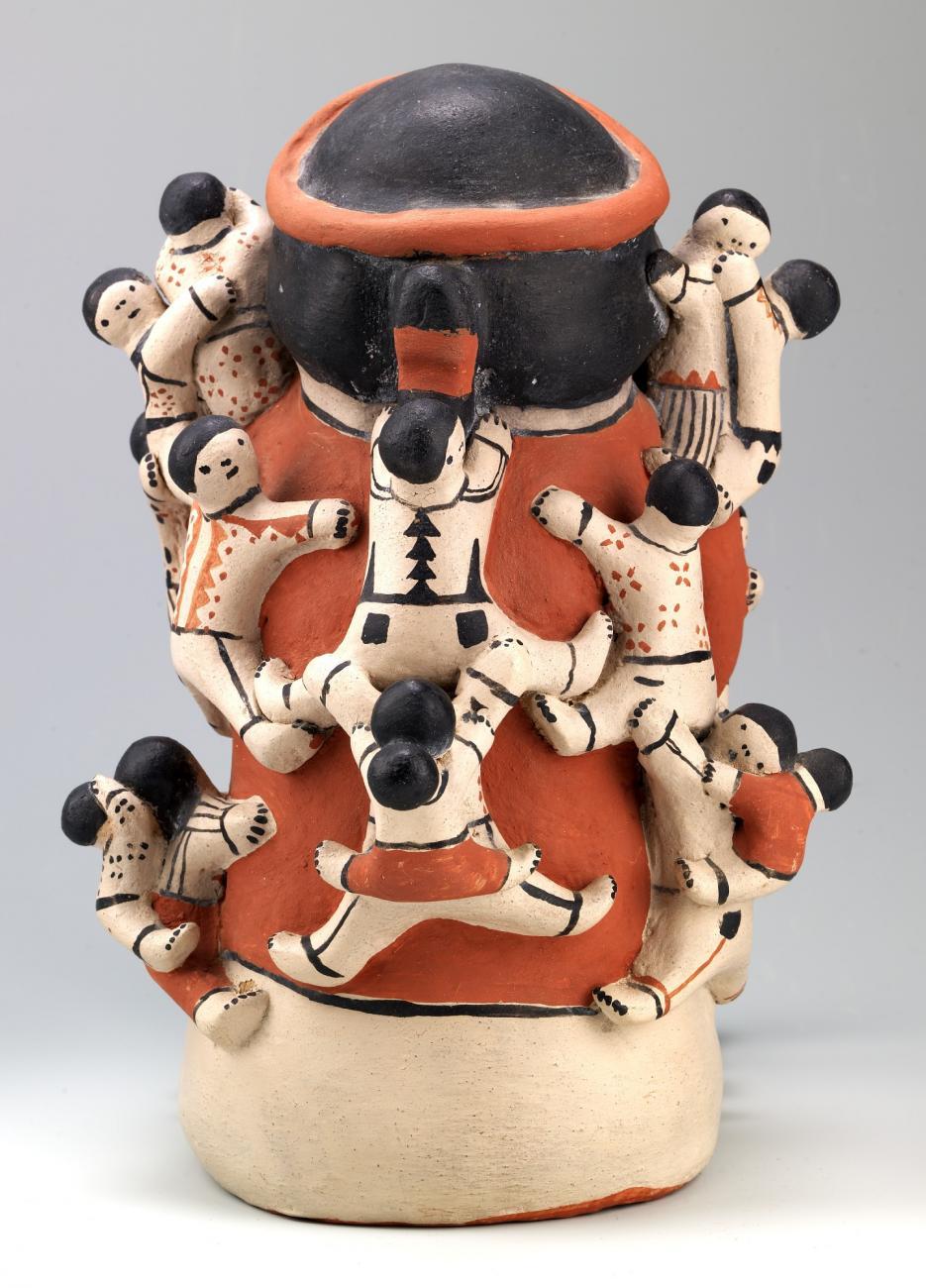 ceramic with a figure of a grandfather figure and (kudos to him) twenty children