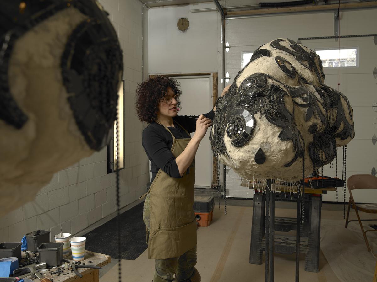 A photograph of an artist in their studio