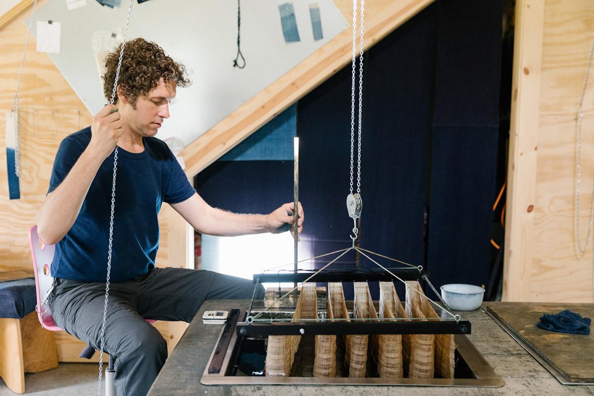 A photograph of an artist in their studio