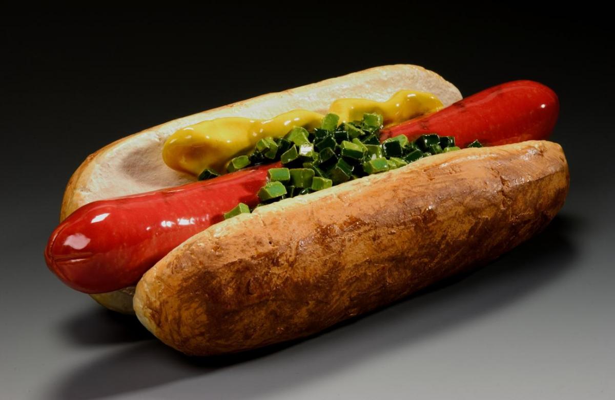Photograph of a large ceramic hot dog.
