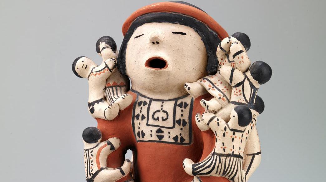 Blog - Fire, Cloud, Earth: Native Women Artists at SAAM An artwork of a figure with small figures climbing on it.