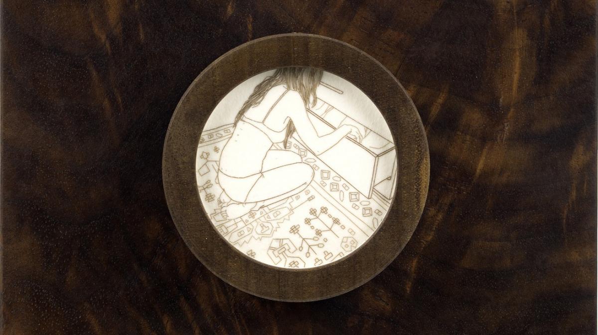 A circle with a drawing inside. 