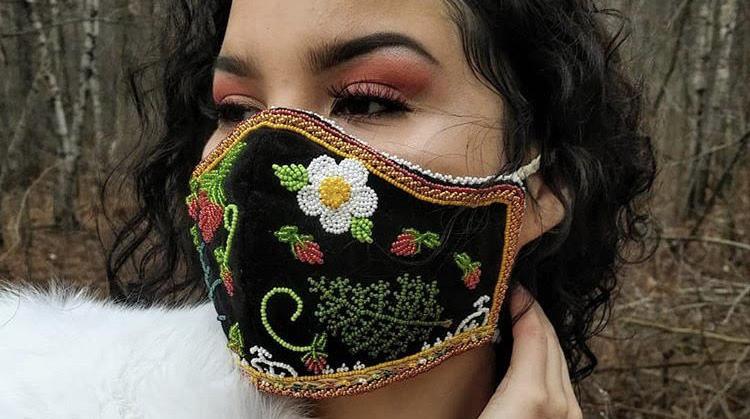 A photograph of a woman wearing a face mask. 