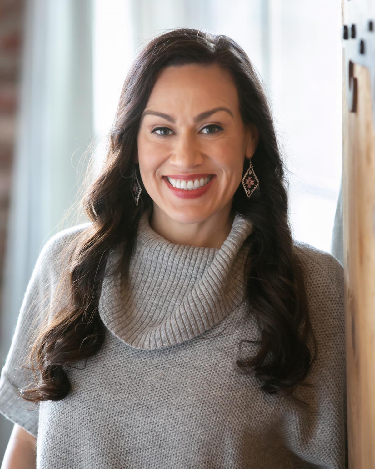 A headshot of a woman